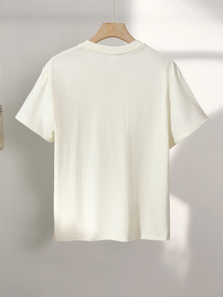 Cooles Damen T-Shirt: Mit abstraktem Gesicht Print in Rosa, Weiß oder Apricot. Modernes Kurzarm Shirt für einzigartige Freizeit-Mode.