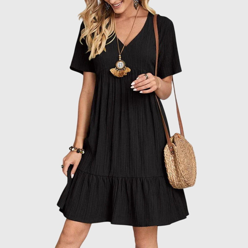 Flatterndes Damen Boho Midikleid, elegant & bequem. Farbiges Sommerkleid mit Kurzarm für Freizeit und Strandmode.