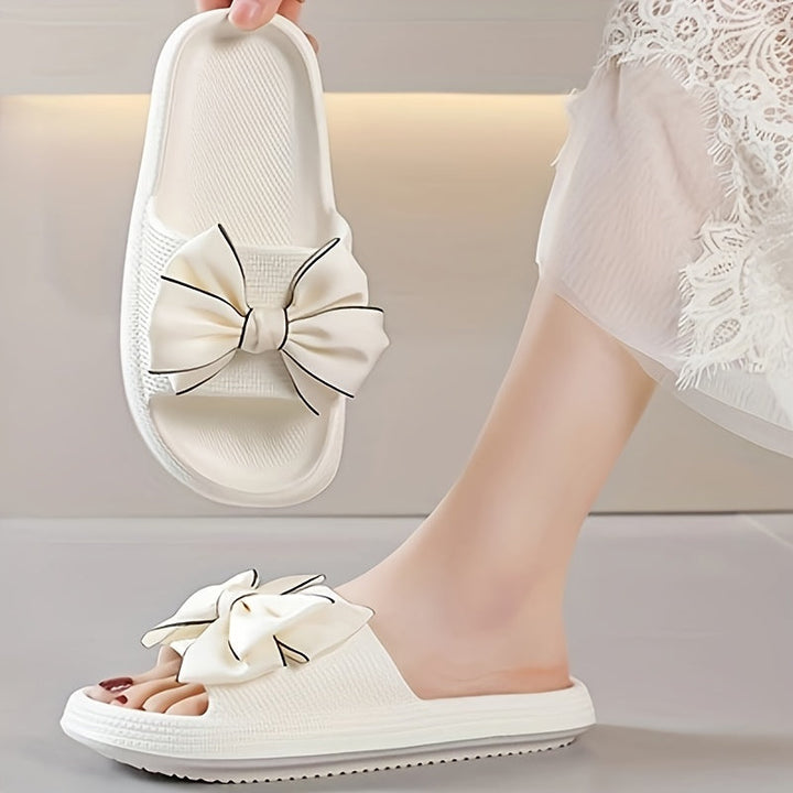 Damen Slide Sandalen mit Schleife, ideal als Poolschuhe oder bequeme Urlaubsschuhe.