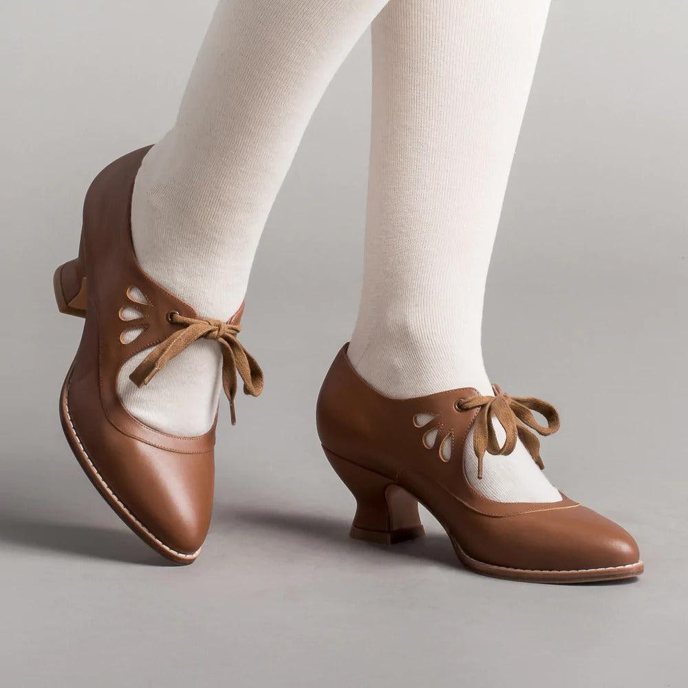 Rutschfeste, hochhackige Damenschuhe mit integrierter Fußgewölbestütze. Für Eleganz & Sicherheit den ganzen Tag.