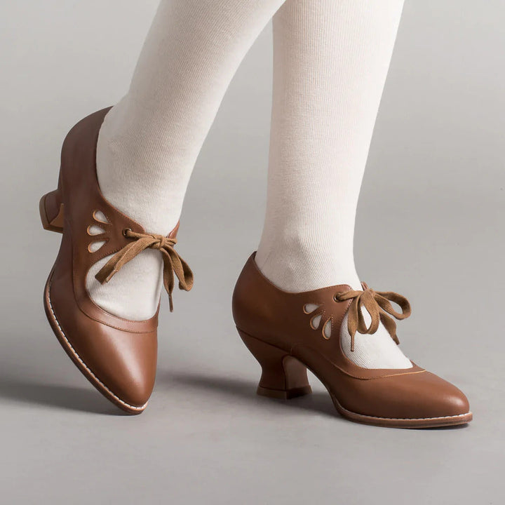 Rutschfeste, hochhackige Damenschuhe mit integrierter Fußgewölbestütze. Für Eleganz & Sicherheit den ganzen Tag.