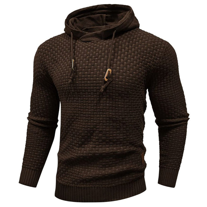 Herrenpullover mit Kapuze, Detailaufnahme. Weicher Stoff, ideal für kalte Tage.