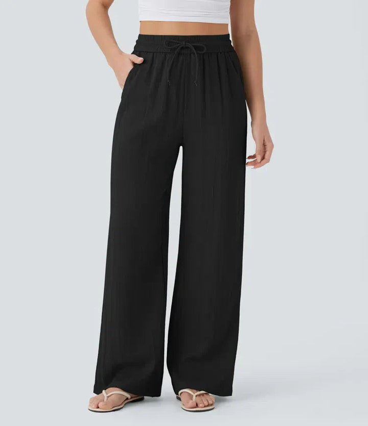 Stilvolle Damenhose mit weitem Bein, perfekt für den Sommer. Lockerpassform & Kordelzug. Ideal für Urlaub.