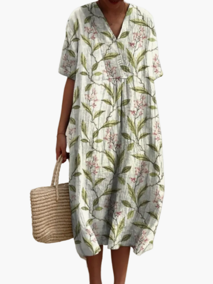 Romantisches Damen Blumenkleid, Vintage-Look, kurze Ärmel, Midilänge, perfekt für sommerliche Ausflüge.