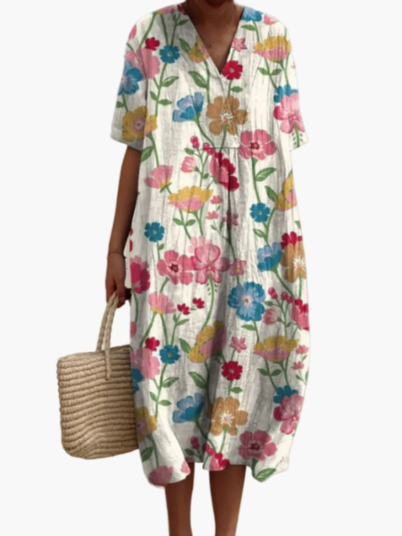 Stilvolles Urlaubskleid für Damen mit floralem Vintage-Print, kurze Ärmel, bequem und elegant zugleich.