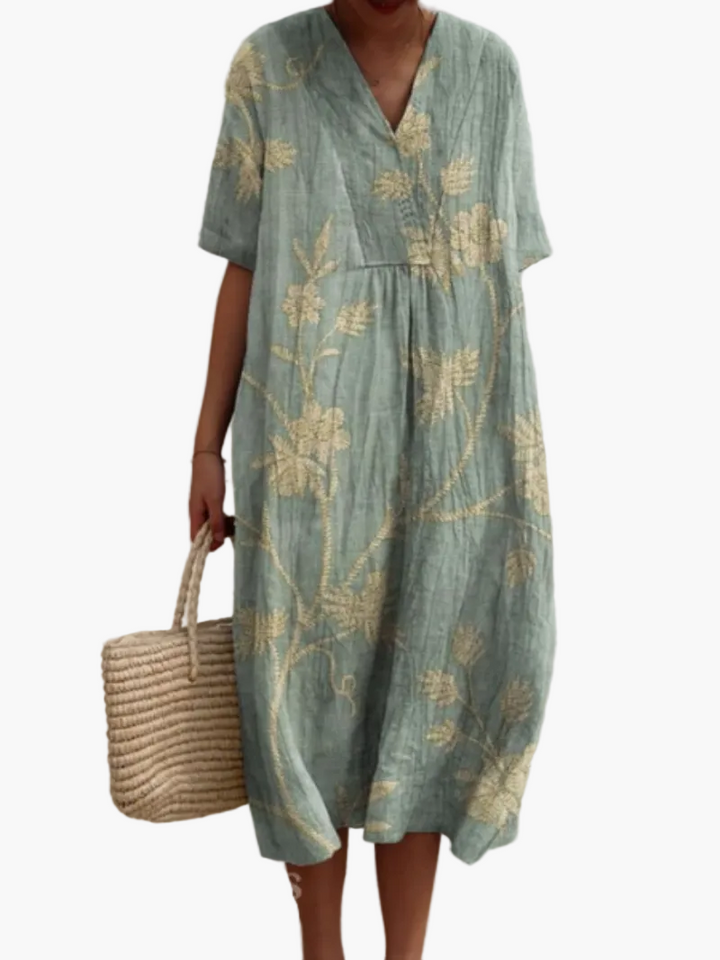 Feminines Vintage Midikleid mit Blumenmuster, kurze Ärmel, ideal für den Sommerurlaub und entspannte Tage.
