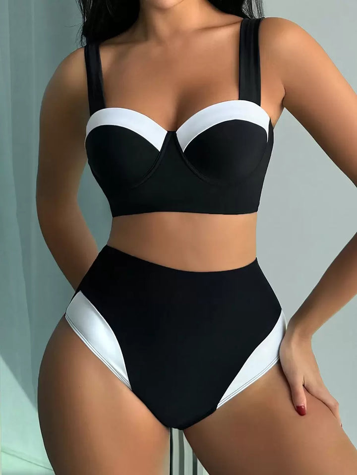 Eleganter Damen Bikini Zweiteiler Schwarz-Weiß mit Push-Up Oberteil und High Waist Hose. Perfekt für Sommer.