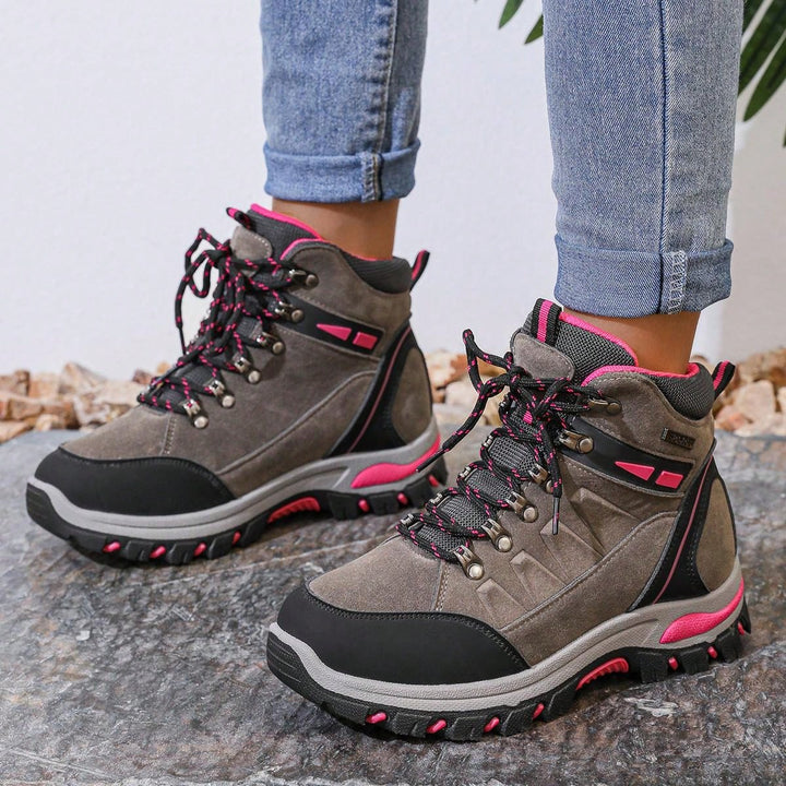 Rosa Damen Wanderschuhe mit ergonomischem Design, die den Fuß auf langen Wanderungen unterstützen.