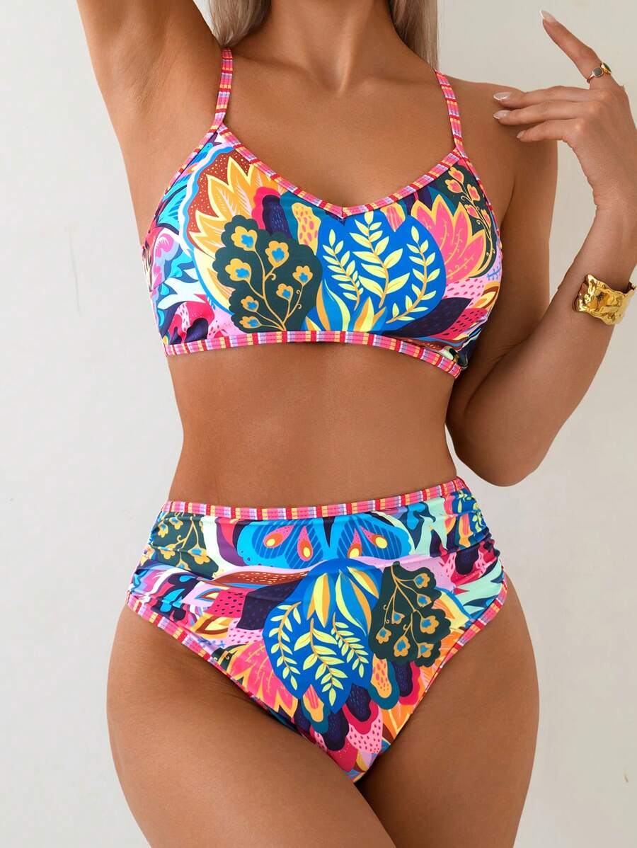 Modisches Damen High-Waist Bikini-Set in Blau mit tropischem Muster. Perfekter Zweiteiler für Sommer & Urlaub.