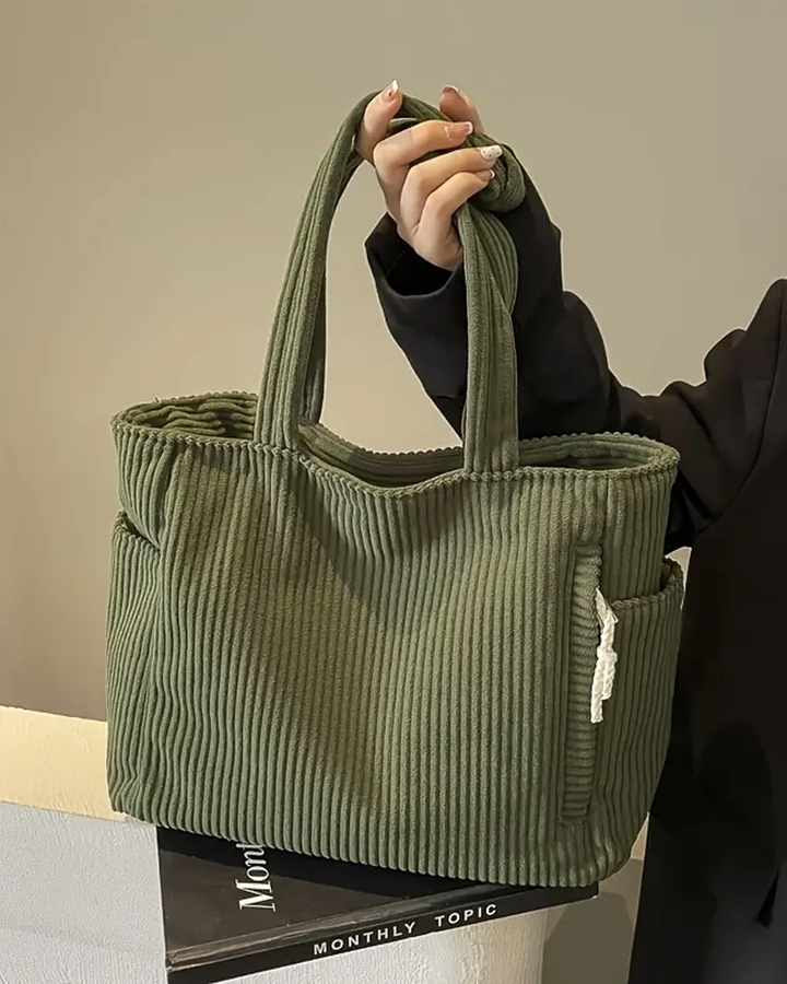 Grüne, gerippte Damen Tragetasche mit Kordelzug, elegant für Alltag und Büro.