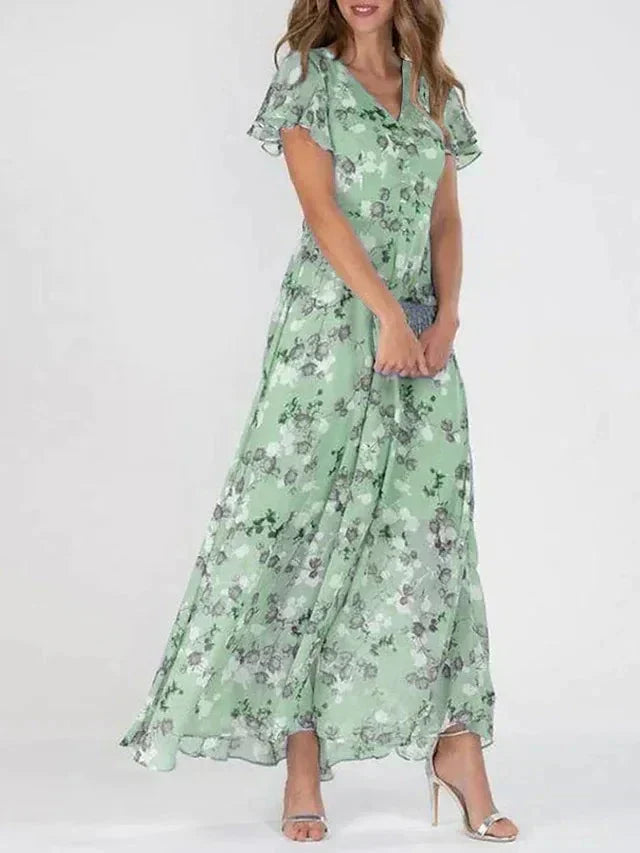 Feminin fließendes Sommerkleid für Damen mit V-Ausschnitt, buntem Blumendruck, perfekt für Freizeit und Strandurlaub.