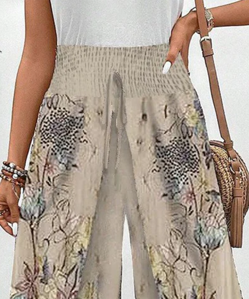 Damen Freizeithose mit Blumenmuster und elastischem Bund in Aprikose, locker und sehr bequem für den Sommer.