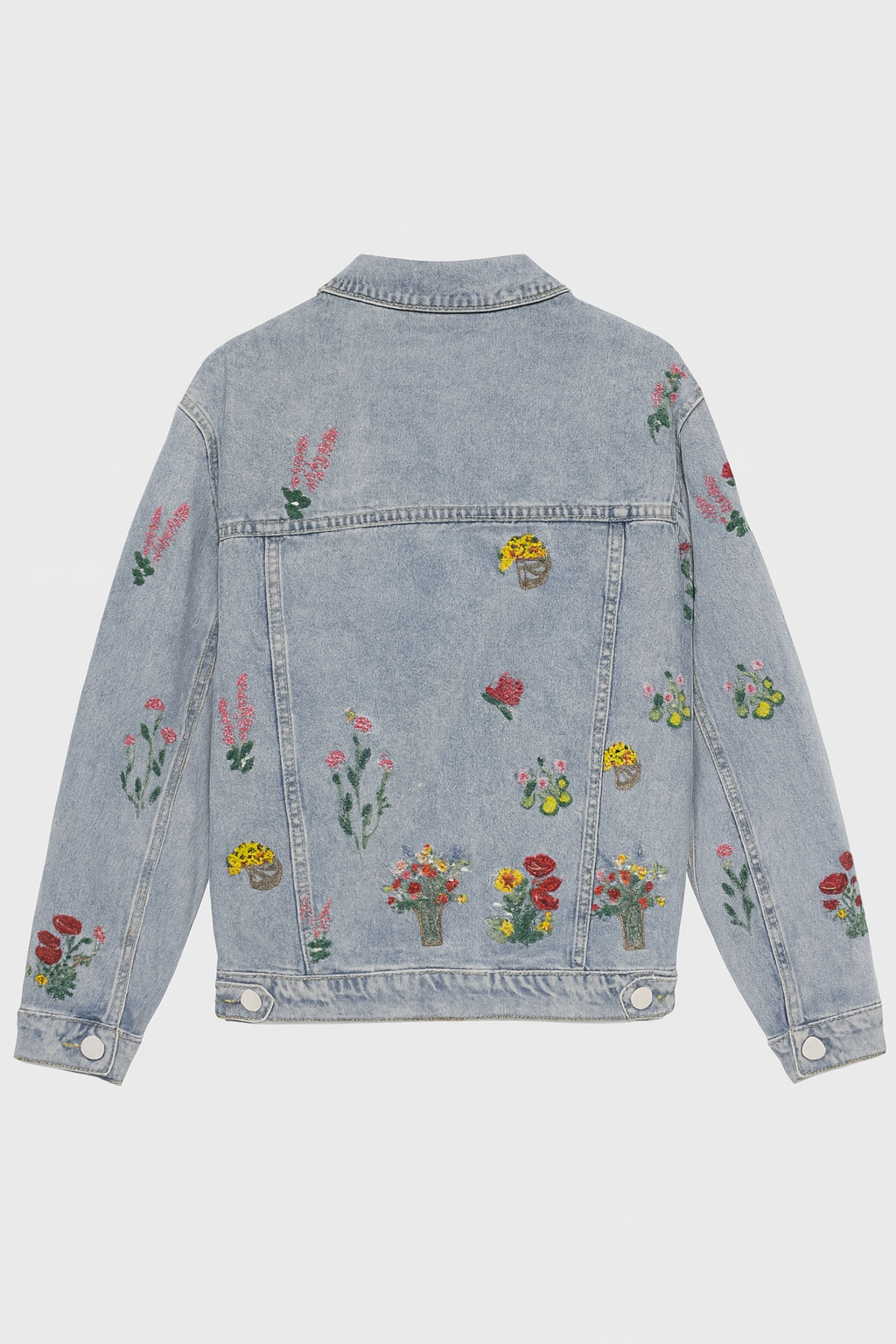 Trendige Damen Denim Jacke in Blau mit farbiger Blumenstickerei. Oversize Passform, ideal für Frühling & Herbst Casual Style.