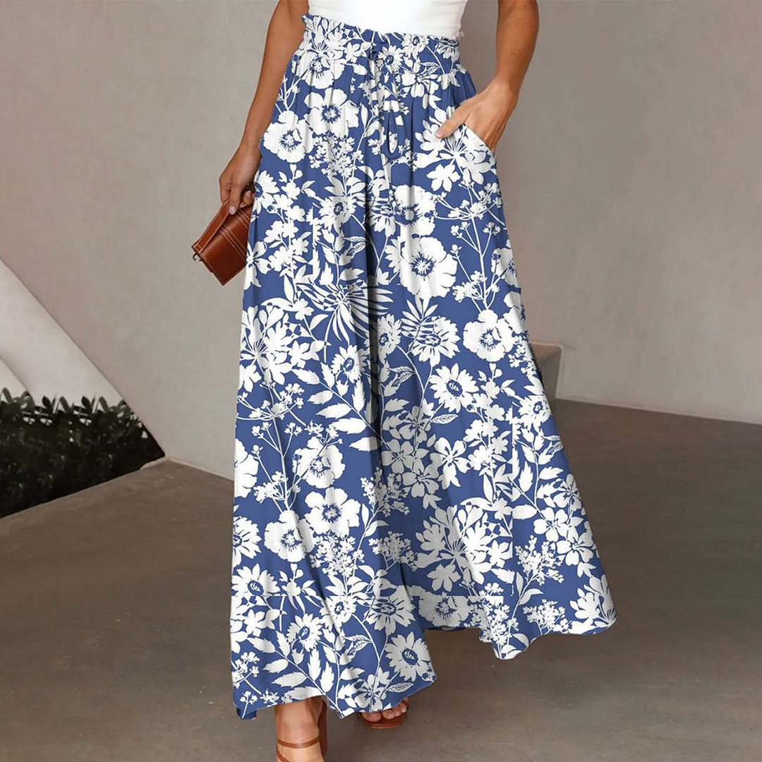 Elegante Damenhose mit buntem Blumenmuster und elastischem Bund. Bequeme Freizeithose für Damen, ideal für Alltag und Sommer.