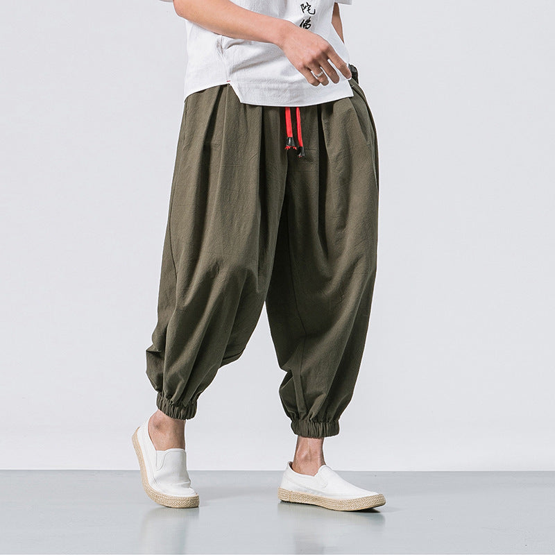 Herren Haremshose lässig in Schwarz für Streetwear, mit weitem Bein und Kordelzug für entspannten Look.