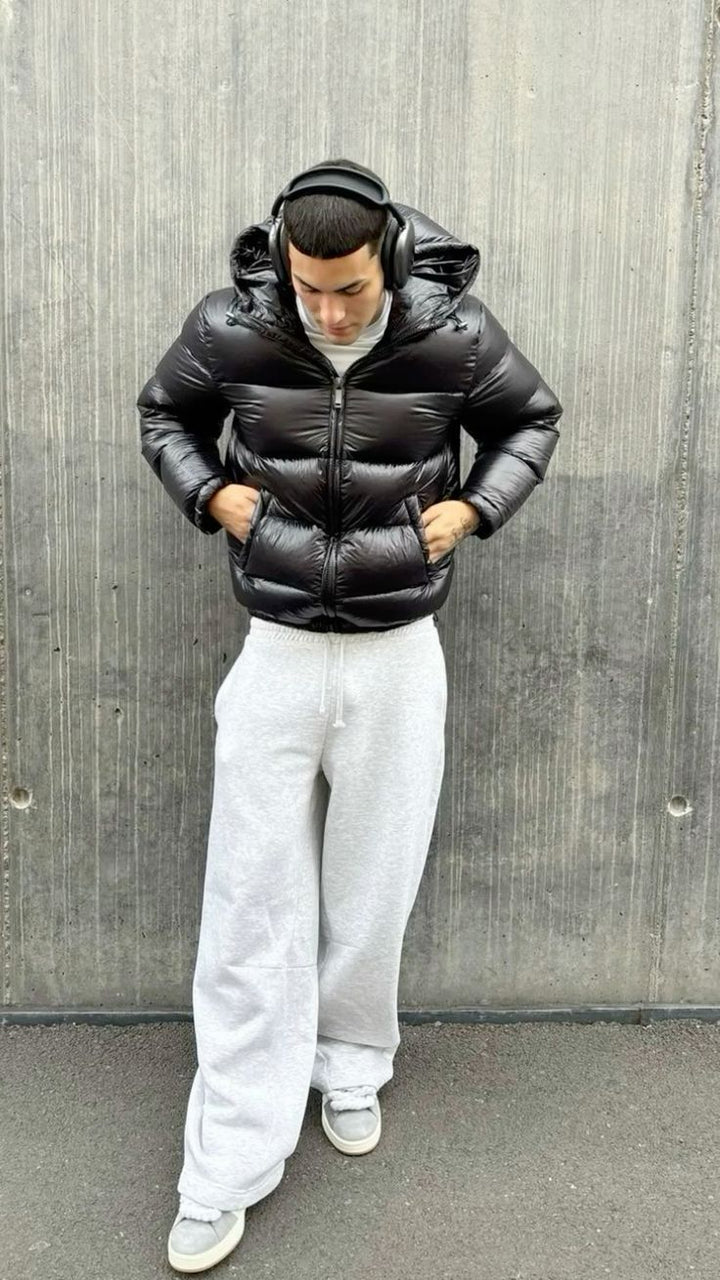 Warme Herren Steppjacke mit Kapuze, ideal für kalte Wintertage und Outdoor-Aktivitäten.