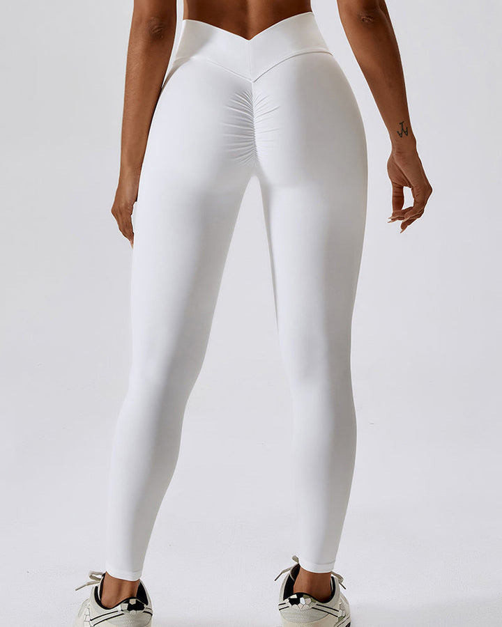 Vordere Ansicht der Damen Fitness Leggings. Zeigt den stilvollen V-Bund und die komfortable High Waist Passform.