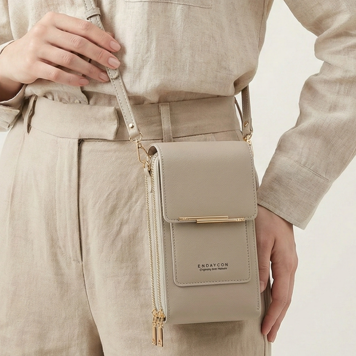Praktische Alltags-Crossbodytasche aus PU-Leder, sicheres Reißverschlussfach und Touchscreen-Funktion.