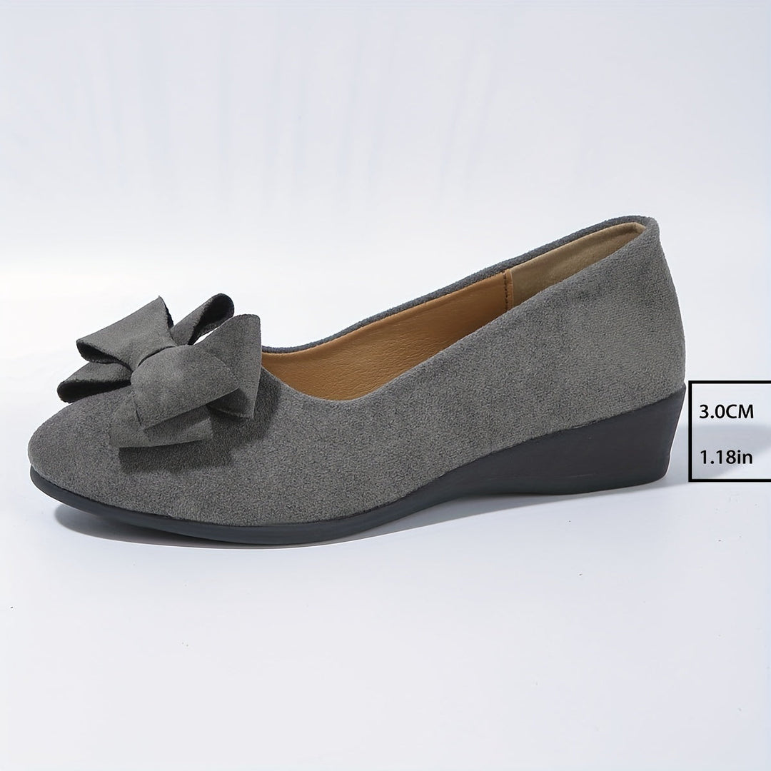 Modische Damenschuhe: Ballerinas mit Schleife & gepolsterter Sohle für stilvolle Damen.