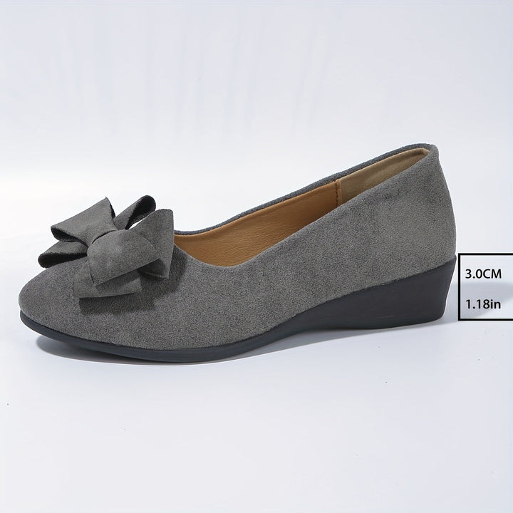 Modische Damenschuhe: Ballerinas mit Schleife & gepolsterter Sohle für stilvolle Damen.