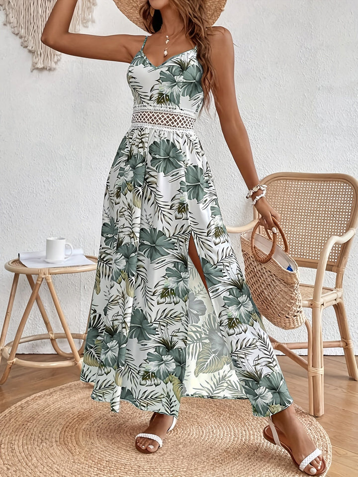 Damen Urlaubskleid: Langes Sommerkleid mit Blumenmuster und eleganten Trägern.