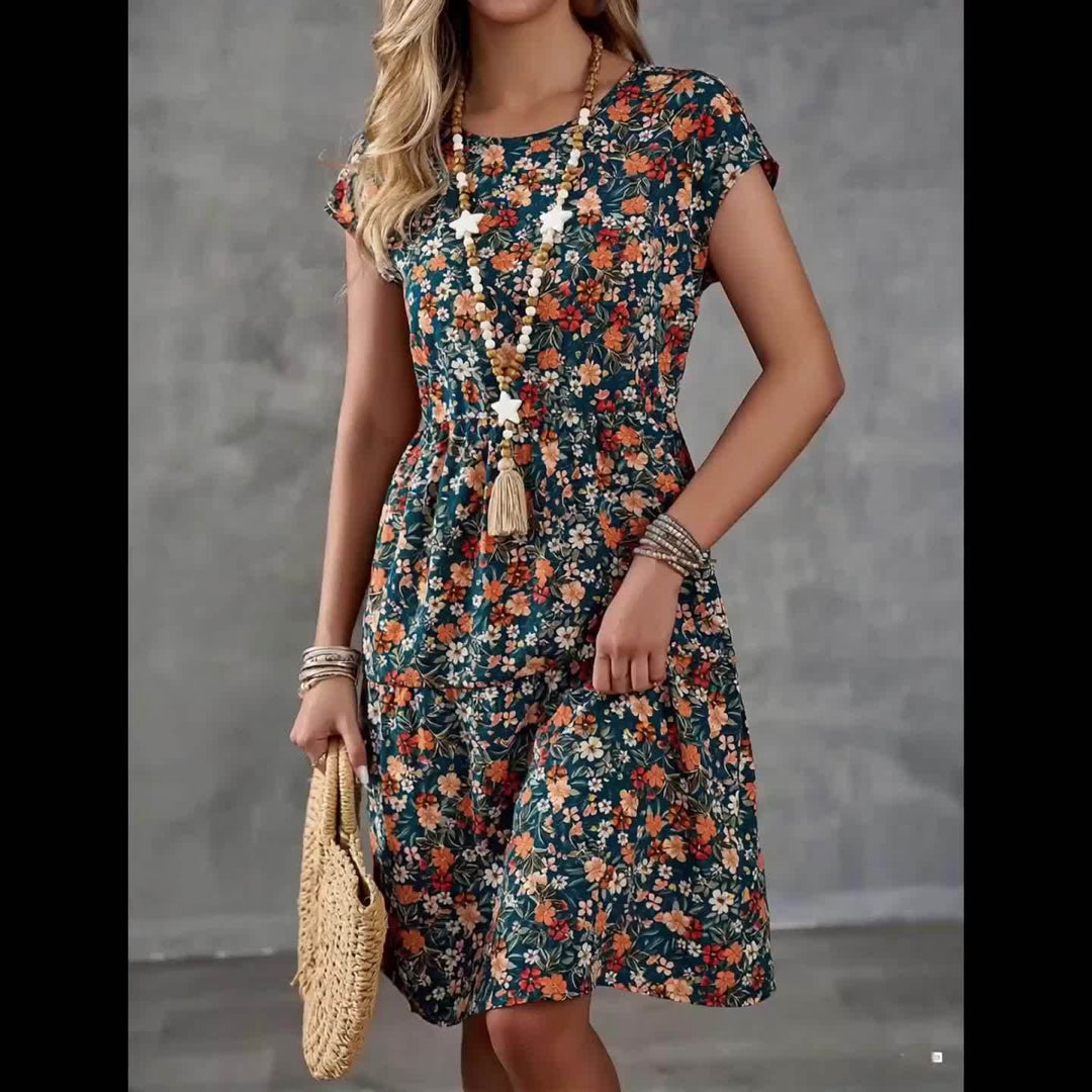 Bequemes Damen Freizeitkleid, knielang, Kurzarm, mit Blumenmuster. Perfekt für entspannte Sommertage.