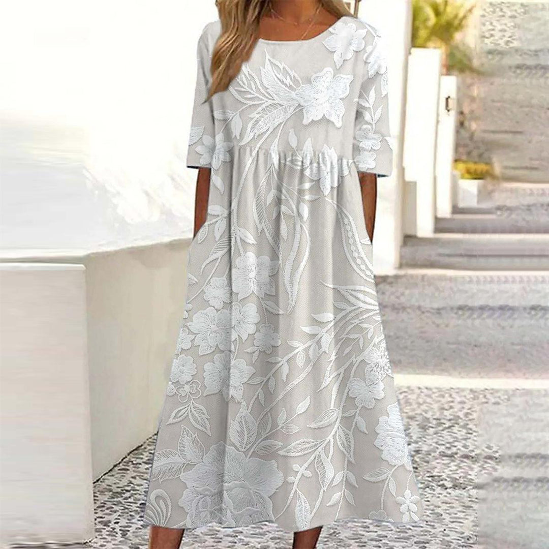 Elegantes A-Linie Damen Midikleid mit stylischem Print, kurzen Ärmeln und praktischen Seitentaschen, ideal für Sommer.
