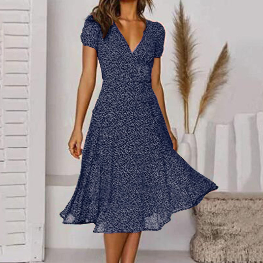 Damen Wickel-Midikleid in A-Linie. Feminines Sommerkleid mit eleganten Puffärmeln und tiefem V-Ausschnitt.