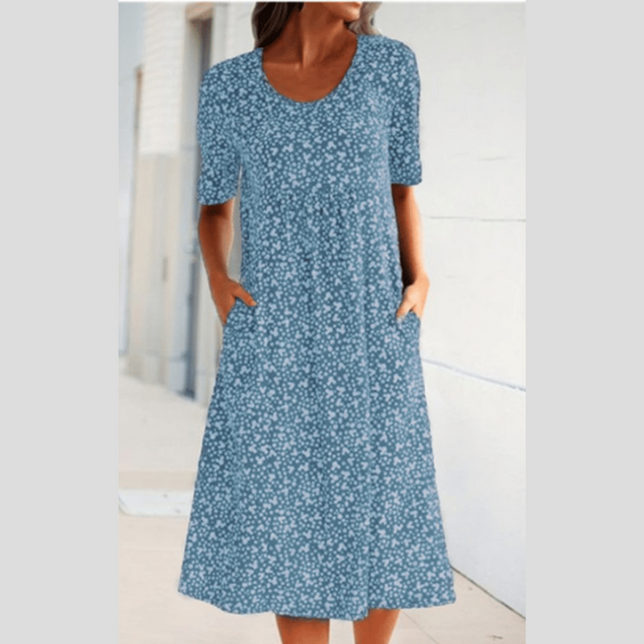 Vielseitiges Sommerkleid für Damen: Elegantes Midikleid mit floralem Muster und praktischen Taschen, perfekt für Anlässe.