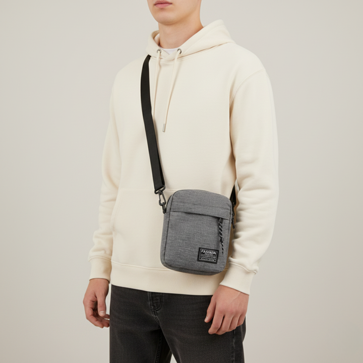 Graue minimalistische Unisex Umhängetasche, klein. Robust für Alltag, freihändig tragbar auf Reisen.