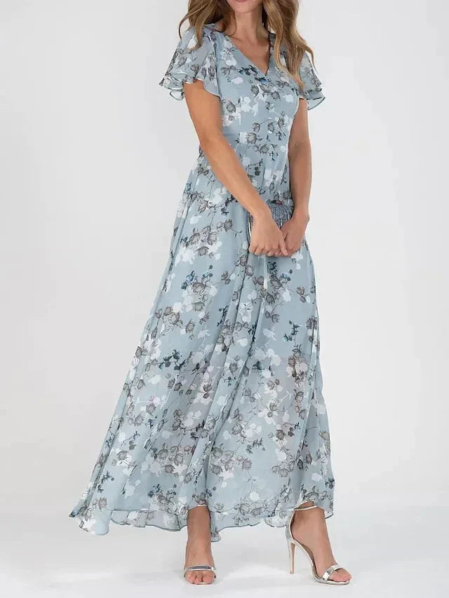 Damen Maxikleid ärmellos mit V-Ausschnitt, Spaghettiträgern und rückenfreiem Design in leuchtenden Sommerfarben.