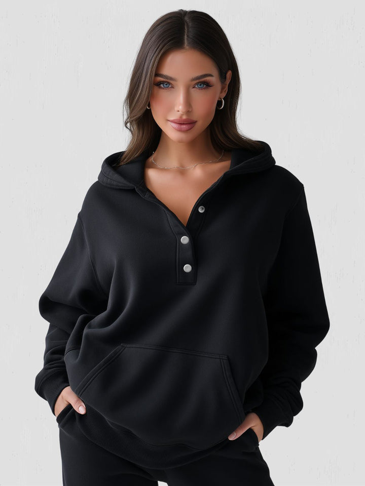 Sportlich eleganter Damen Kuschelpullover, oversized Kapuzenpullover mit Viertel-Knopfleiste für kalte Tage.