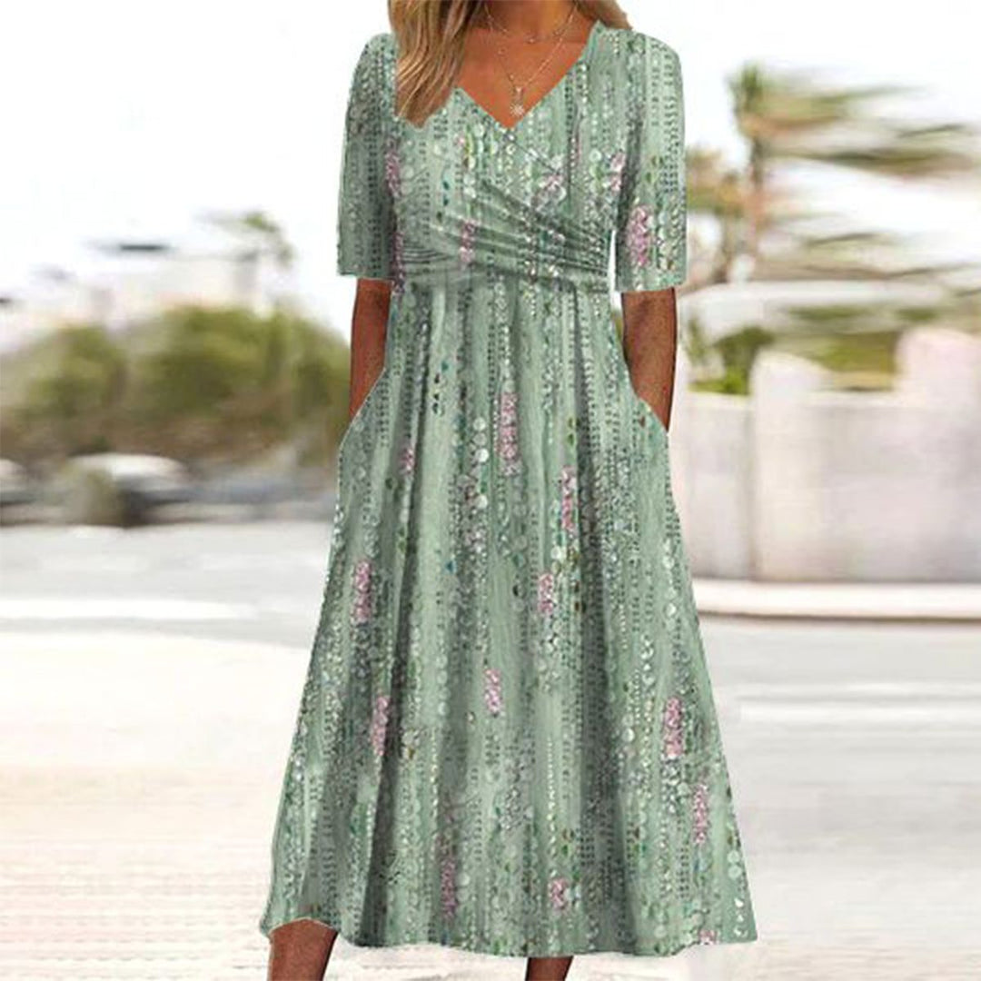 Grünes Damen Midikleid mit elegantem Pflanzenmuster, V-Ausschnitt und kurzen Ärmeln. Perfektes Sommerkleid.