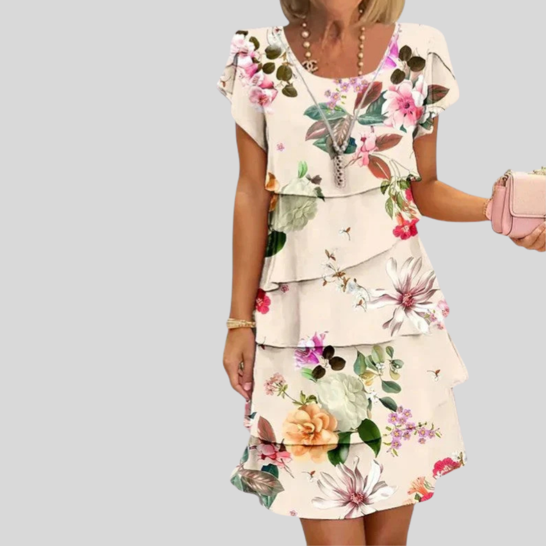 Schickes Damen Midi Kleid mit Blumenmuster und fließendem Stufenrock; ein vielseitiges festliches Abendkleid.
