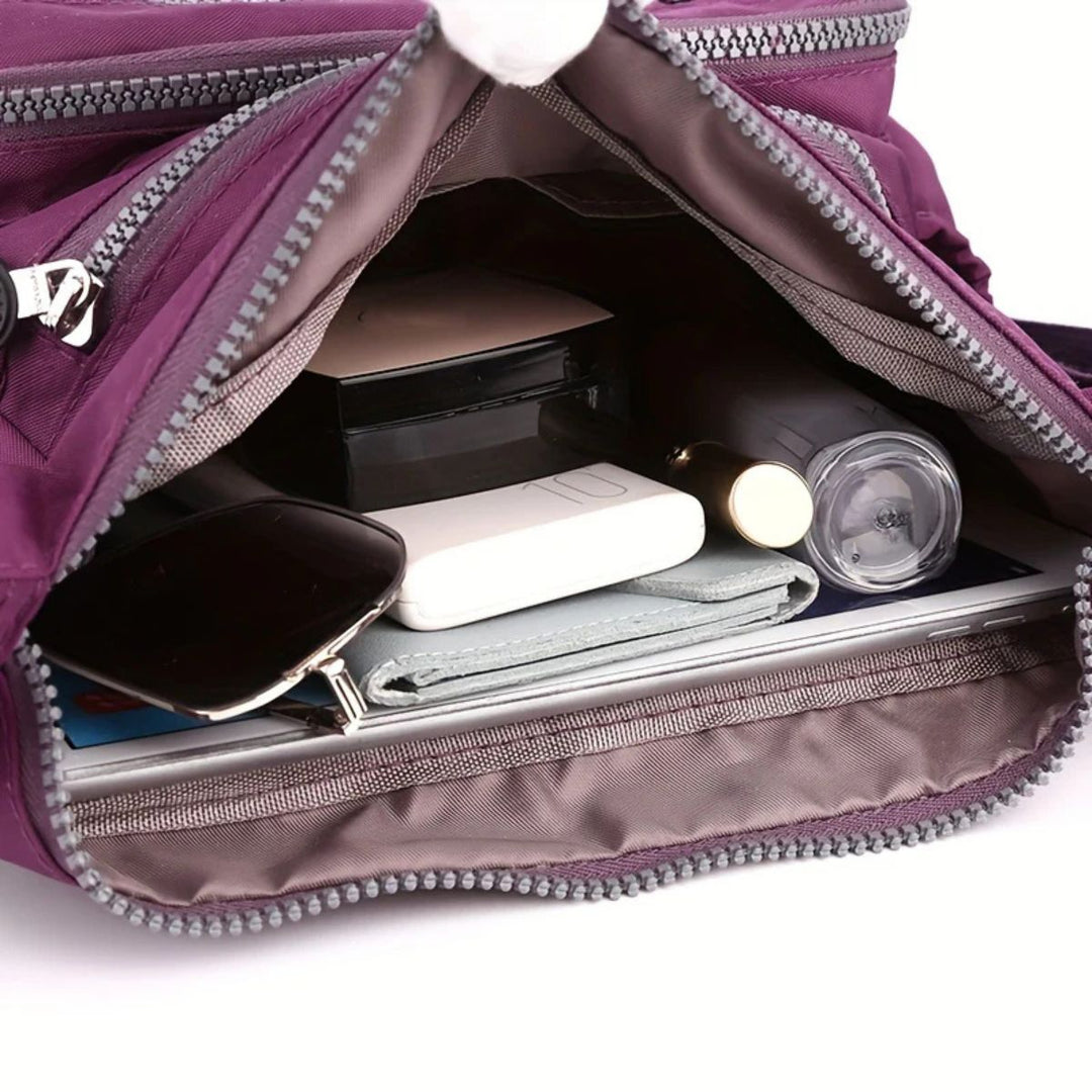 Elegante schwarze Damen Schultertasche aus robustem Material. Perfekte Begleitung für Büro & Freizeit.