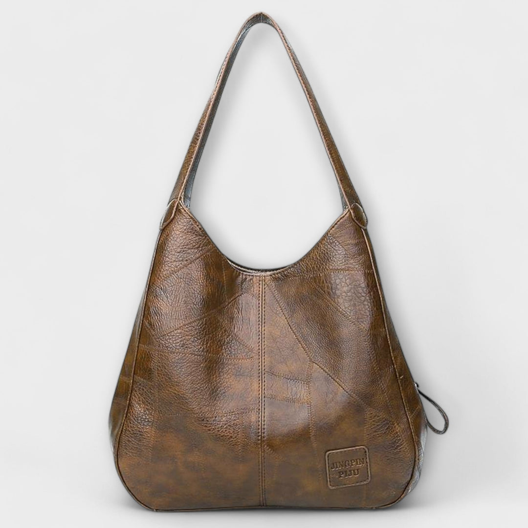Detailansicht: Vintage Ledertasche, unisex, braun, mit elegantem Metallverschluss, ideal für Business.