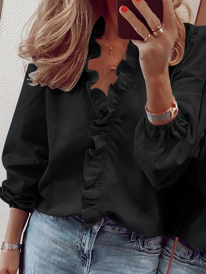 Damen Oberteil: elegante Rüschenbluse mit langen Ärmeln, schmeichelnder V-Ausschnitt, perfekt für Frühling.