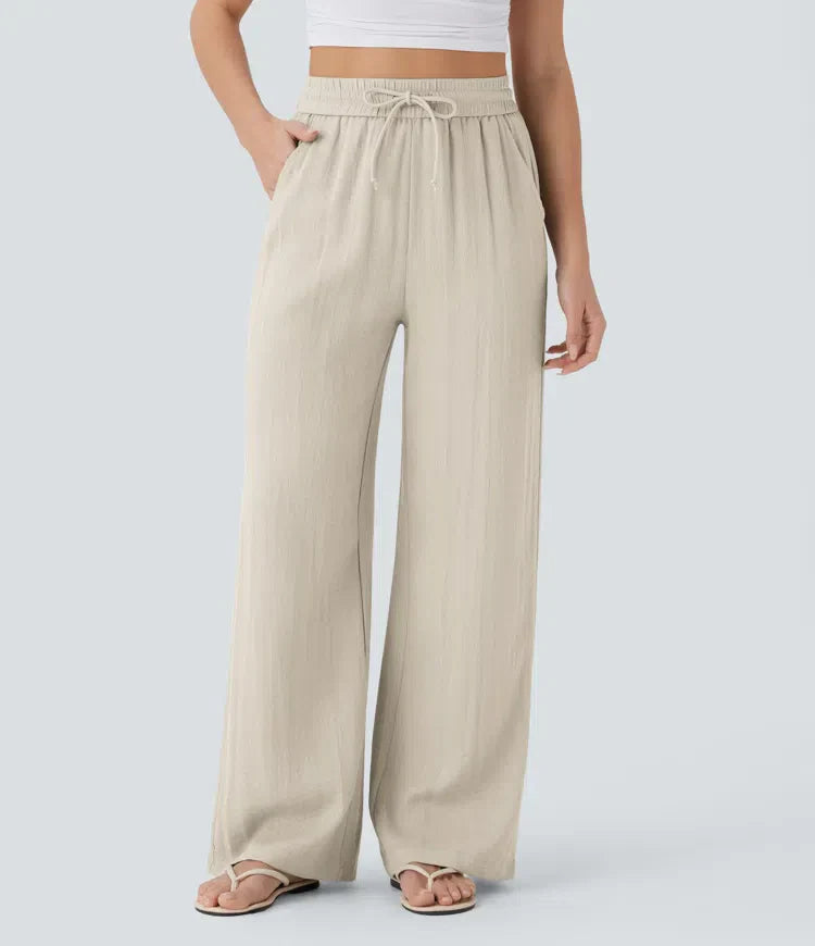 Elegante Damen Sommerhose mit weitem Bein, Kordelzug & Seitentaschen. Bequeme Freizeithose für Urlaub & Alltag.