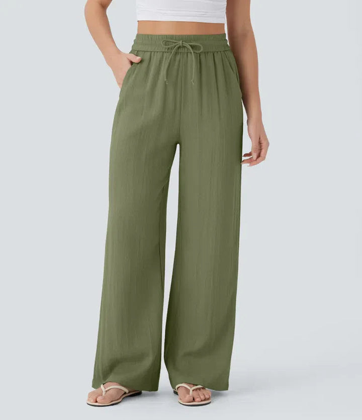 Stilvolle Damenhose mit weitem Bein. Sommerlich-elegant, bequeme Passform mit Kordelzug & Seitentaschen.