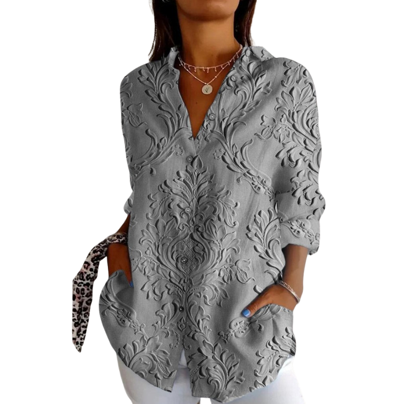 Feminine Langarmbluse mit edlem floralen Prägedesign. Ideal als stilvolles Oberteil für Büro oder besondere Anlässe.
