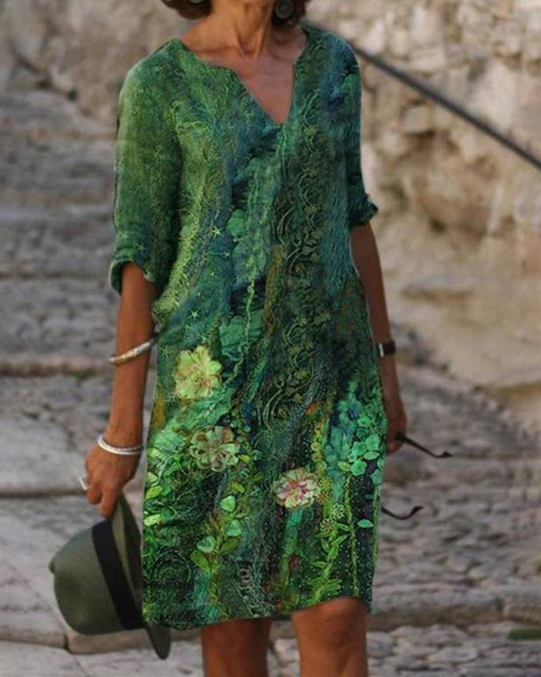 Schickes Damen Midi-Blumenkleid mit V-Ausschnitt und 3/4-Arm, ein elegantes Freizeitkleid.
