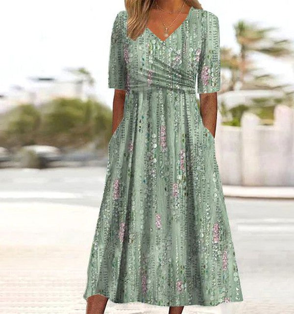 Elegantes grünes Damen Midikleid in A-Linie mit V-Ausschnitt und floralem Muster. Ideal als Freizeit-Sommerkleid.
