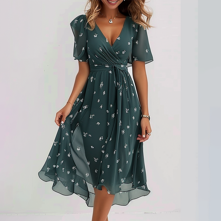 Grünes Damen Midikleid mit V-Ausschnitt und kurzen Ärmeln in A-Linie. Elegantes Sommerkleid für Freizeit und Mode.