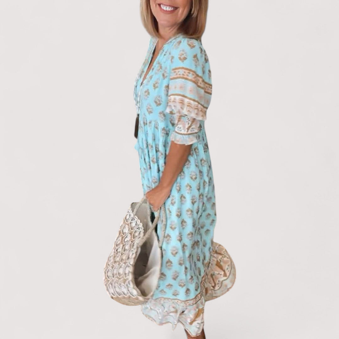 Modisches V-Ausschnitt Sommerkleid für Damen. Knielang, figurbetont und komfortabel im Alltag.