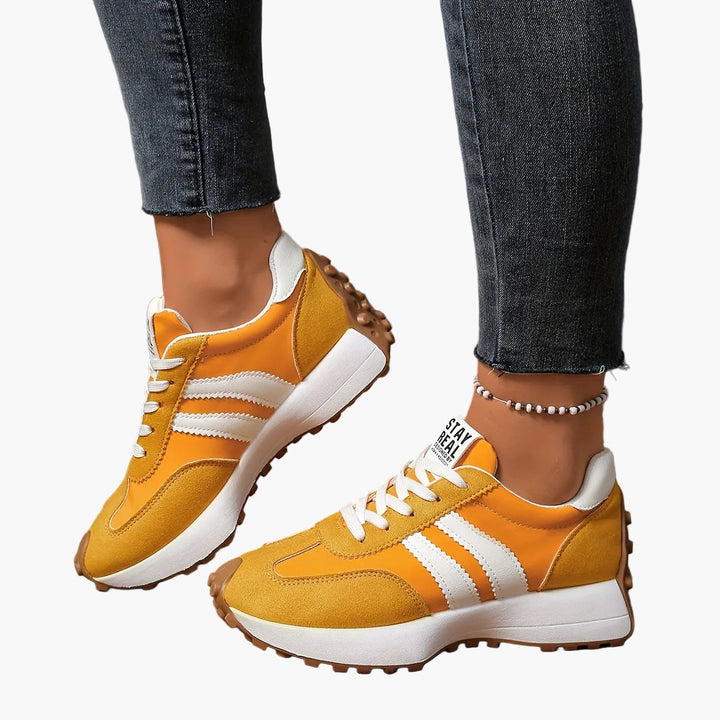Vintage Damen Turnschuhe mit auffälligen Streifen, bequeme Freizeitschuhe mit Retro-Charme.