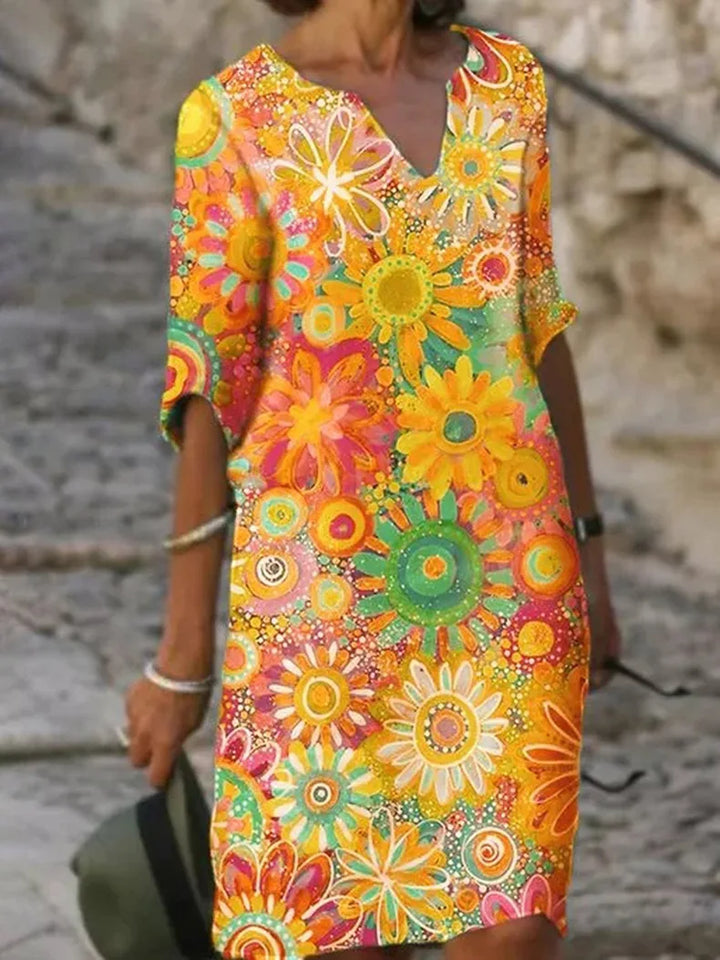 Bequemes Damen Shiftkleid mit floralem Muster, V-Ausschnitt und langen Ärmeln. Ideales elegantes Herbstkleid.
