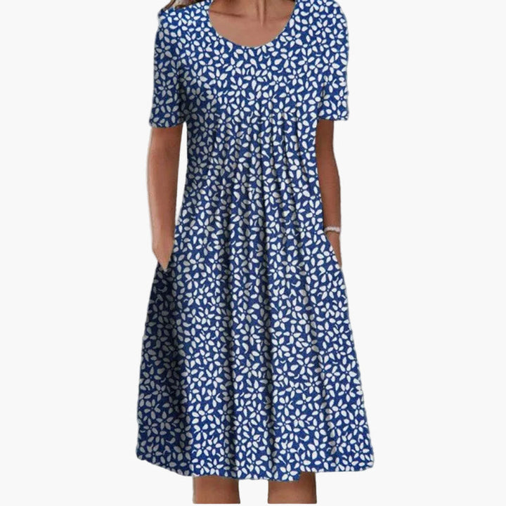 Stilvolles Damenkleid A-Linie mit Blumenmuster und Taschen. Leichtes Sommerkleid für entspannte Tage.
