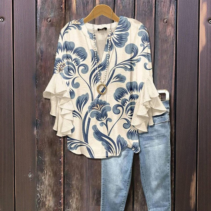 Schicke Damenbluse mit floralem Print und eleganten Rüschenärmeln. Vielseitiges Oberteil für Business & Freizeit.