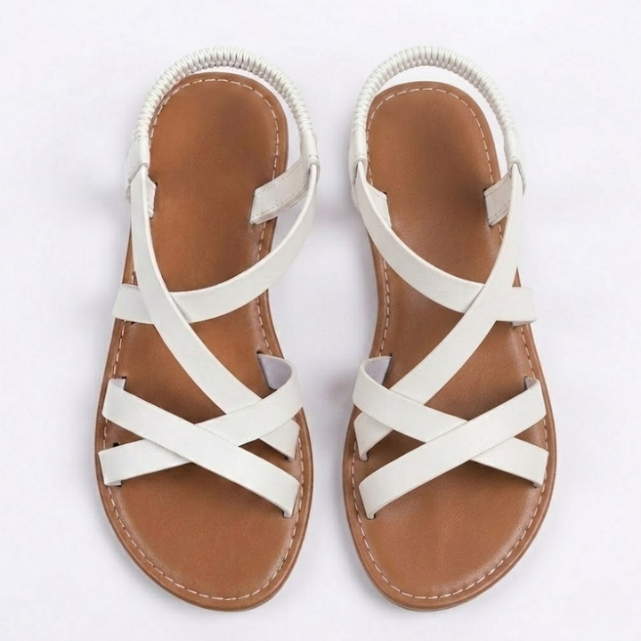 Leichte Damensandalen flach mit breiten überkreuzten Riemen und bequemer Sohle für unbeschwerte Sommertage.
