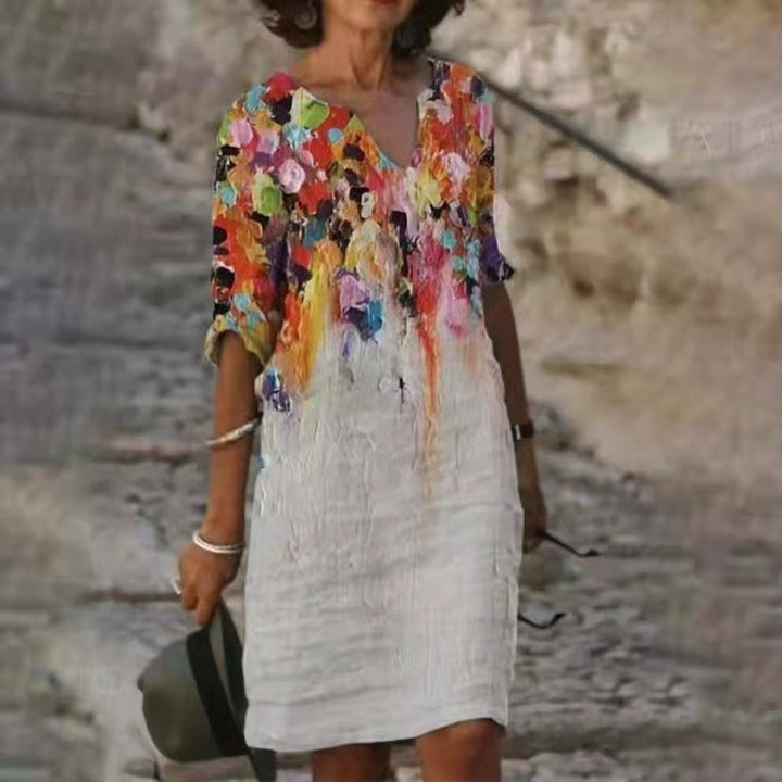 Damen Midi-Kleid mit floralem Print, V-Ausschnitt und 3/4-Arm, ideal als leichtes Strandkleid.